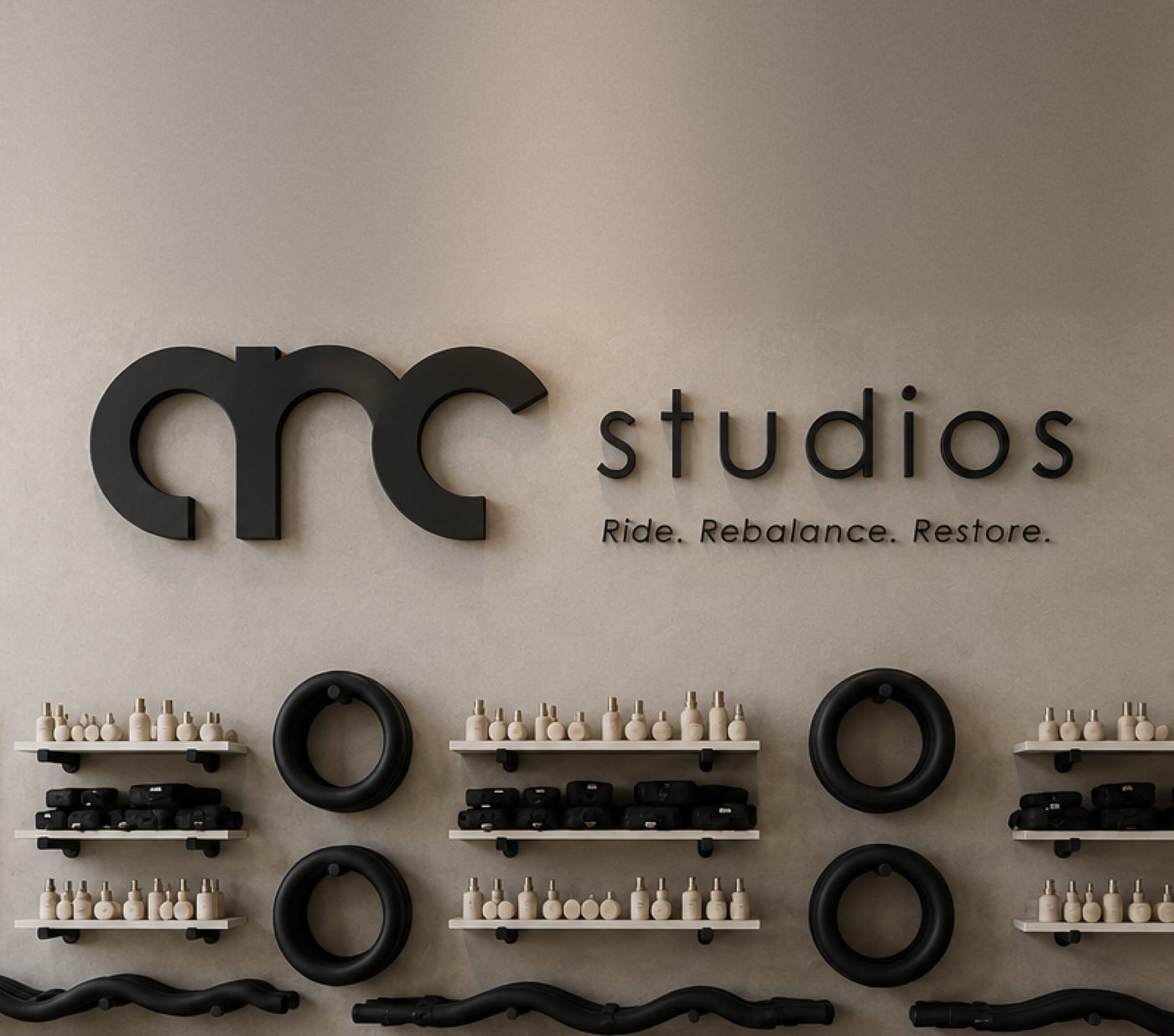 Concept render of the ARC studio wall with the ARC Studios sign, mats and equipment
